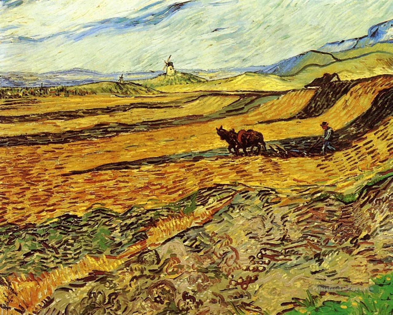 Champ et laboureur et moulin Vincent van Gogh Peintures à l'huile